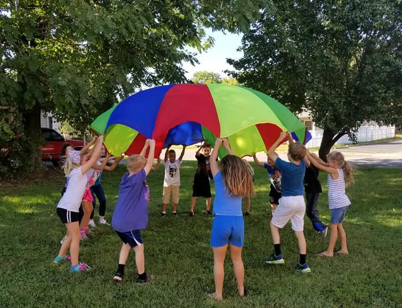 Kids playing parachute game